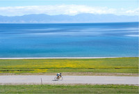 A cyclist riding around Qinghai Lake