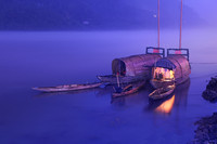 Classic Chinese boats mooring on Qiantang River at dusk