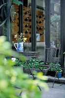 A Chair and a Desk in a Small Cafe Garden