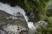 A Waterfall Pours down in a Valley of China